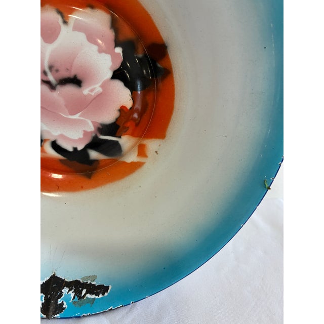 This vintage enamel bowl by Peacock features a hand painted floral design with vibrant color and expressive brushwork. The...