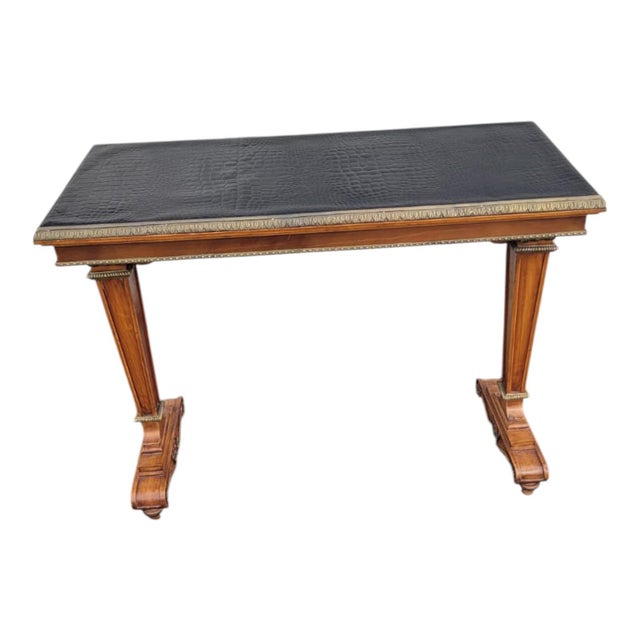 1940s vintage French satinwood console/sofa table with elegant inlay and decorative bronze mounts. Features a distinctive...