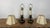 An exquisite and highly atmospheric pair of small-scale English candlestick table lamps, in the Georgian Revival taste,...