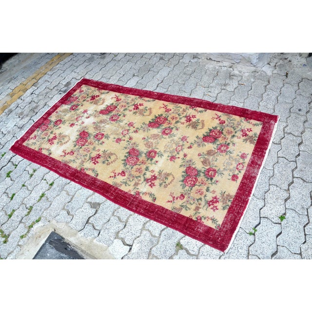 This is a vintage Turkish Oushak rug from the 1960s. The piece was hand-knotted.