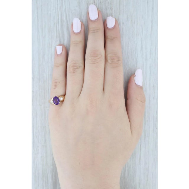 Gemstone Information: - Natural Amethyst - Carats - 1.50ct Cut - Oval Brilliant Color - Purple - Natural Diamonds - Total...