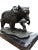 A gorgeous bronze casting of an american grizzly bear, 20th century. The bear is depicted with a salmon in its mouth. The...
