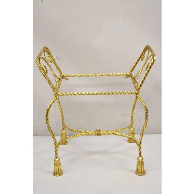 Vintage Italian Hollywood Regency Gold Gilt Iron Rope Tassel Form Vanity Bench Chair Seat. Item features tassel form feet,...