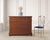 A refined English late 19th century/early 20th century four-drawer faux bamboo fruitwood commode, chest of drawers, or...