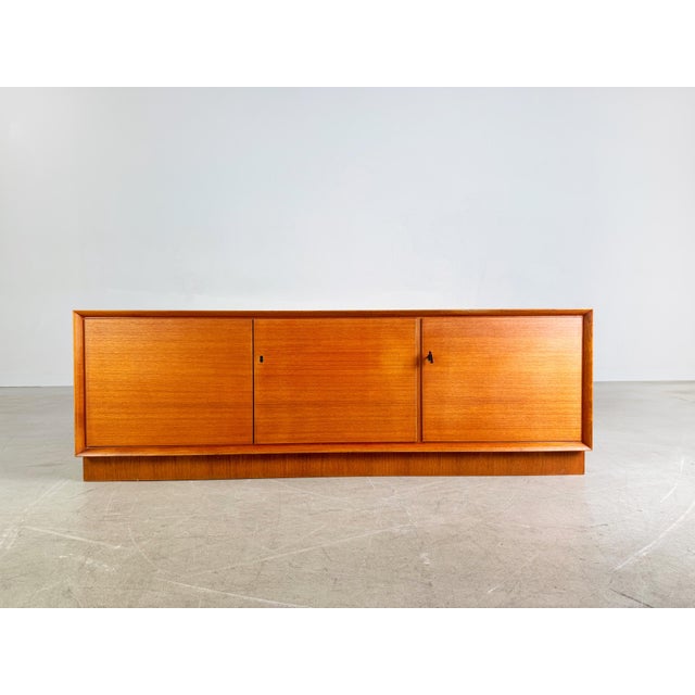 A beautiful teak sideboard/lowboard from the 1960s for sale. This piece of furniture is ideal as a tv stand and, thanks to...