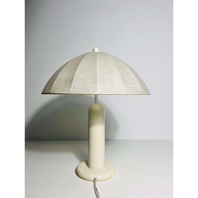 This cocoon table lamp from the 1960s is a fine example of german craftsmanship by goldkant leuchten. Handcrafted with...