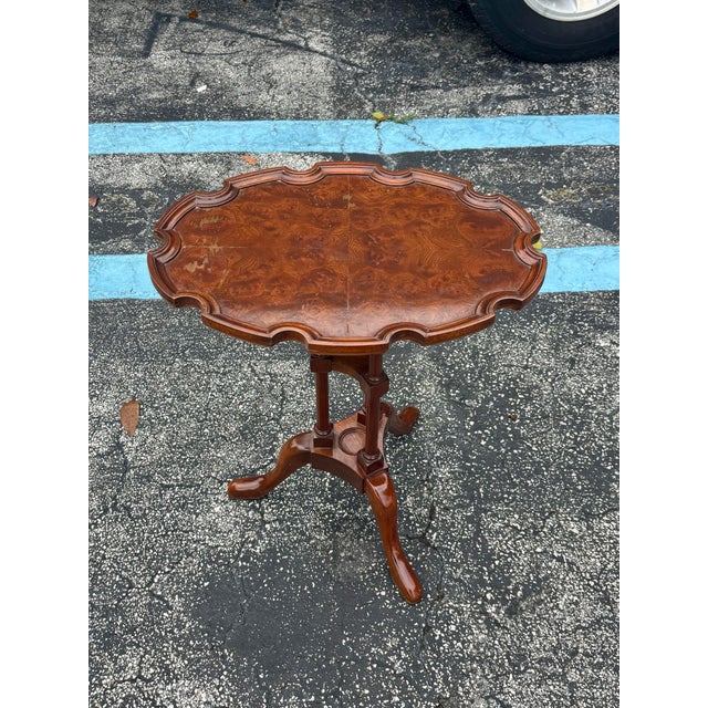 A refined Queen Anne style tea table by Baker Furniture from their esteemed Historic Charleston Collection. Crafted in...