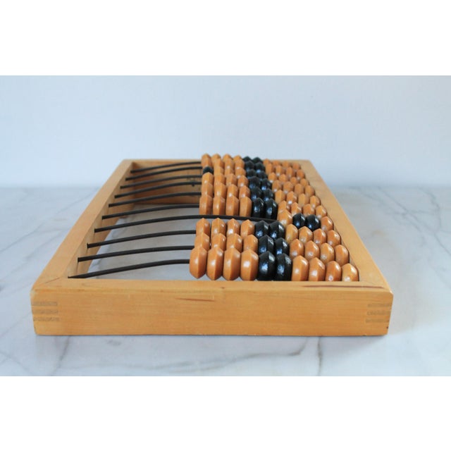 Vintage 1970's Russian wooden abacus. Makers mark stamped. Some age wear. Pictured.
