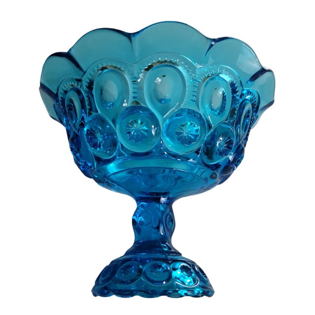 Vintage 1960's Blue L.E. Smith Moon & Stars Glass Pedestal Compote with flared and ruffled edges. Beautiful blue adds a...