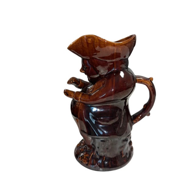 This treacle glazed toby jug is a mid-19th Century product of the famed Rockingham Pottery, in Swinton, Yorkshire. The...