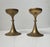 A pair of trumpet shaped brass candlesticks designed and manufactured in Scandinavia during the 1960s. The candlesticks...
