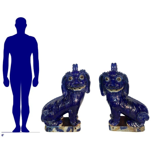 This captivating pair of large 19th Century Chinese earthenware models showcases intricate craftsmanship and vivid cobalt...