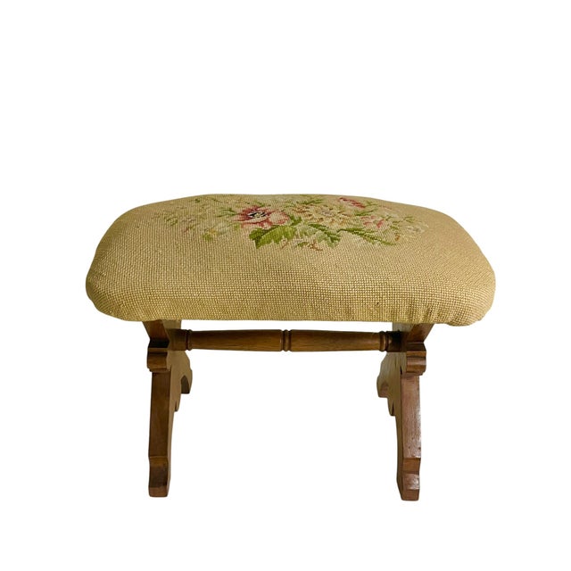 Charming and full of English country-house character, this vintage needlepoint footstool features a beautifully hand-...