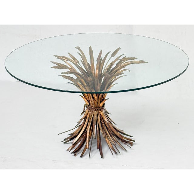 A fine Italian wheat sheaf cocktail or coffee table (or low table) from the Hollywood Regency era, featuring a round glass...