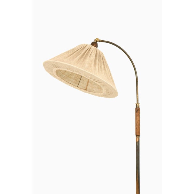 Rare height adjustable tripod floor lamp by unknown designer. Produced in Denmark. Height: 130-167 cm. Wear consistent...