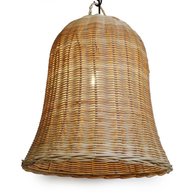 Raw wicker bell shaped pendant lantern. A fun contemporary piece great on its own or in groupings. Natural wicker tones...