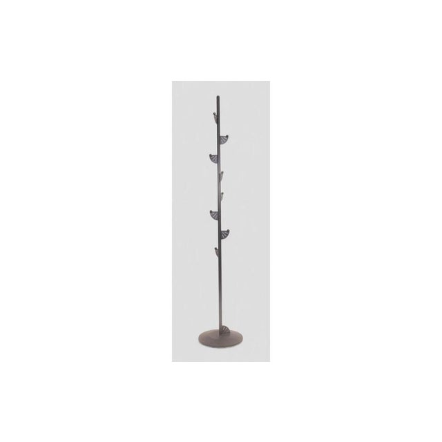 Minimalist black painted metal coat rack with a clean and contemporary design. The slender yet stable structure stands on...