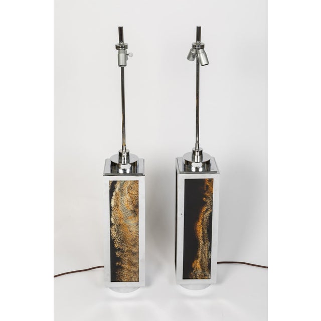 Pair of square shape lamps in bakelite with a mineral motif in black, brown, yellow and beige tones surrounded by chromed...