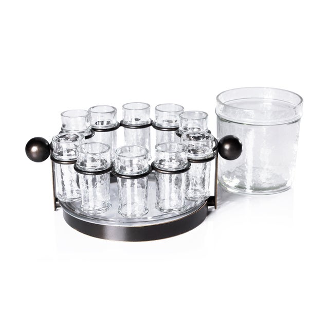 A must-have for tequila enthusiasts, this set includes ten hammered glass shot glasses, a clear hammered glass ice bucket,...