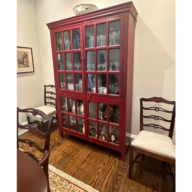 Crate & Barrel Rojo Red Tall Cabinet Stately storage with a red waxed patina, hand-forged iron hardware and wood hasp door...