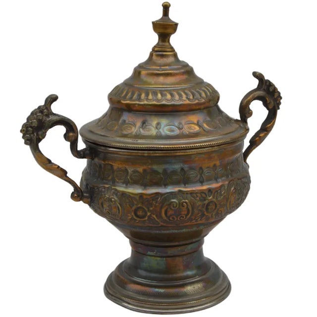 Antique Moroccan hand-hammered candy lidded jar constructed of solid silver and brass. Exhibiting an intricate Arabesque...