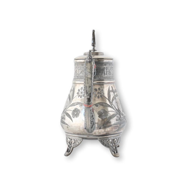 A stunning Pairpoint silver-plated coffee set from the Aesthetic Movement, circa 1880, crafted in New Bedford,...