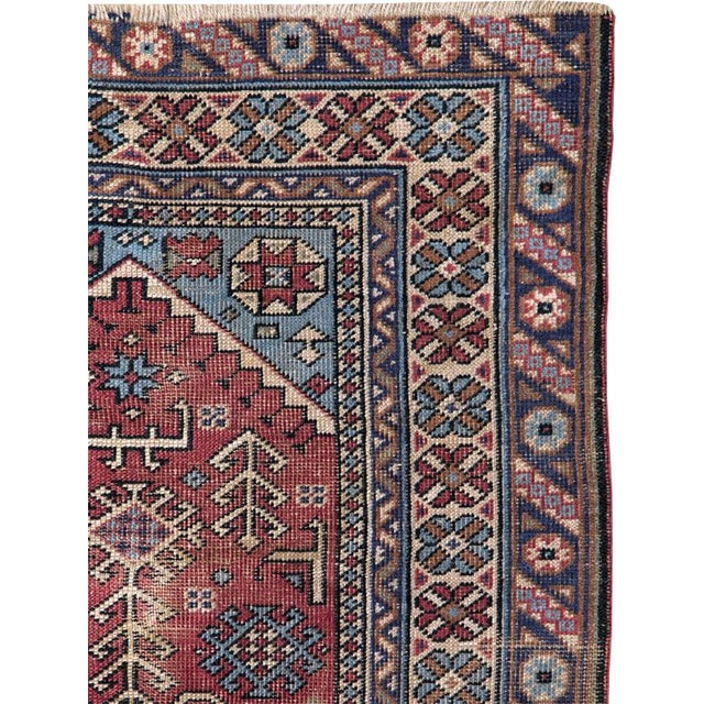 This mid-20th-century Turkish Anatolian throw rug presents a richly detailed prayer design centered on a warm brick-red...
