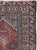 This mid-20th-century Turkish Anatolian throw rug presents a richly detailed prayer design centered on a warm brick-red...