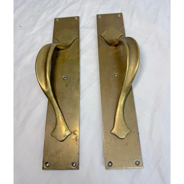 Up for sale is a rare pair of vintage brass Art Nouveau door handles. The handles are made of thick brass and have a...