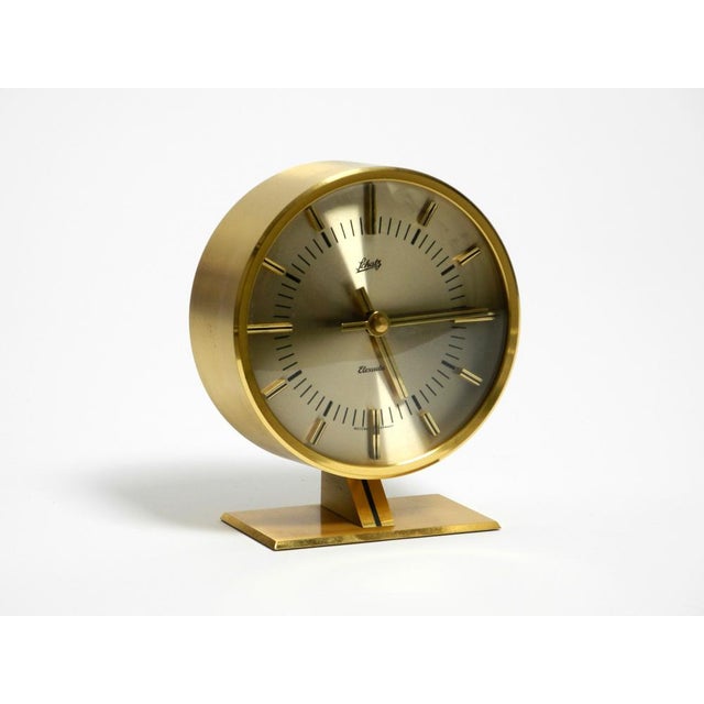 Beautiful, rare, round, original 1960s battery-operated brass table clock by Schatz. The original clockwork is still...