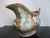 Early 20th century Chinese Famille Rose gravy boat pitcher. Heavy porcelain with hand painted figural design on one side...
