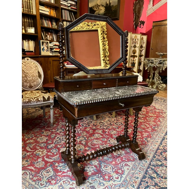 Elegant late 19th century English Victorian dressing table crafted in finely figured mahogany, notable for its compact...