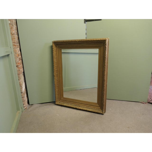This is a lovely wall mirror, it is set in a large Decorative Gilt 6” wide Frame The mirror is in good antique condition...