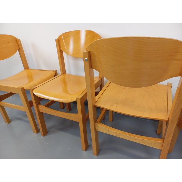 Four vintage 1980s Scandinavian-style chairs, in the minimalist style of Clive Bacon, with beautifully curved backs and...