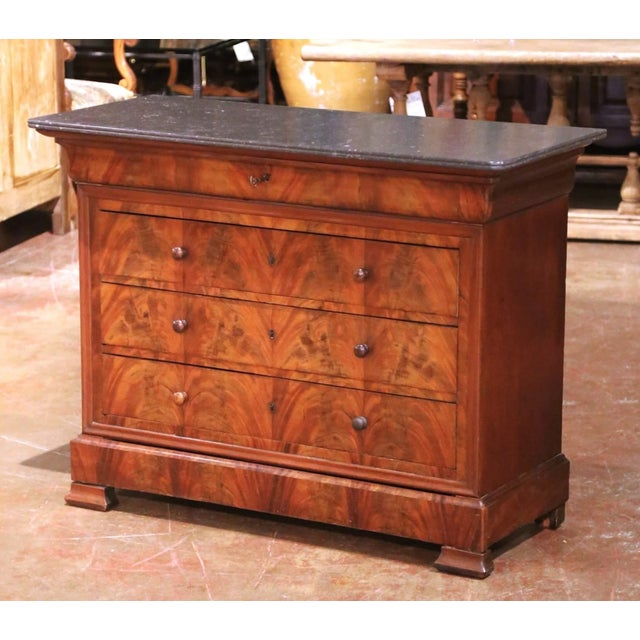 Crafted in France circa 1850, this elegant Louis Philippe commode showcases the refined symmetry and understated grandeur...