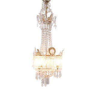 Antique Crystal Chandelier in Gilt Bronze with Louvre Style Decorations, 1890s For Sale