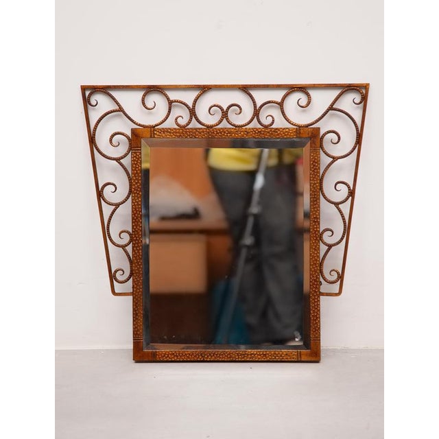 Art deco gilt iron decorated wall hanging mirror, France, ca. 1930. Wrought gilt iron frame with decorative scroll work...
