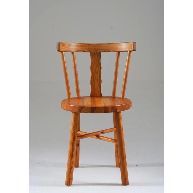 Presenting an exquisite ensemble of five pine chairs created by the esteemed craftsmen of Steneby Hemslöjd, Sweden. Each...