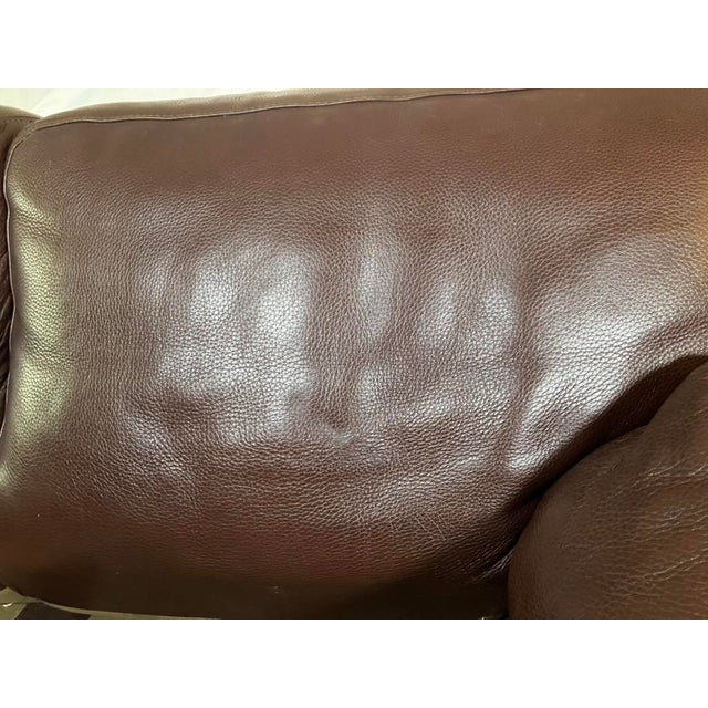Chocolate brown, textured leather Roche Bobois couch from the early 2000s. There are slight scratches, but there are no...