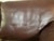Chocolate brown, textured leather Roche Bobois couch from the early 2000s. There are slight scratches, but there are no...