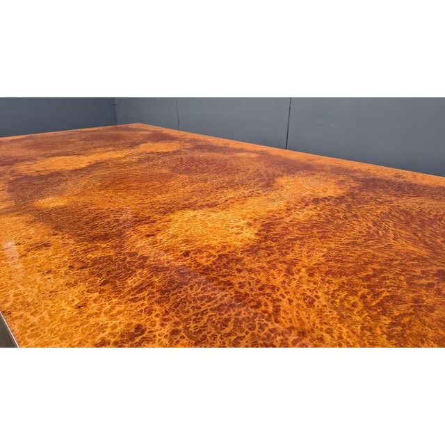 Exclusive dining table with a burl wooden top with a fantastic pattern and solid brass neoclassical inspired base The...