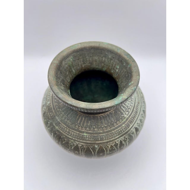 This beautiful water vessel is likely from India or Nepal, dating to the late 19th or early 20th century. Handcrafted from...