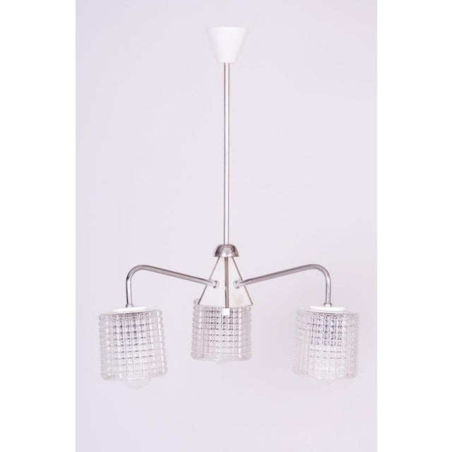 Maker: drukov this three-arm chandelier, produced by the drukov company in brno, is a striking representative of...