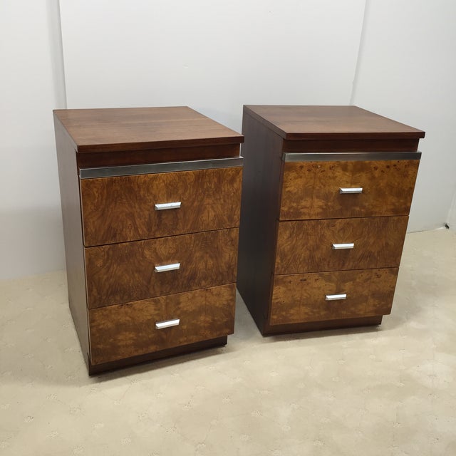 Excellent pair of Walnut three drawer nightstands with book matched burl walnut drawer fronts and silver accent handles...