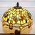 Bring a warm, colourful glow to your home with this striking Tiffany-style stained glass table lamp, featuring a classic...