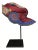 A silk hat from the Miao people of China with bright colors and intricate embroidery. Displayed on a custom stand.