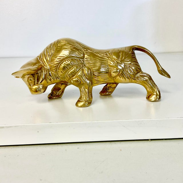 Vintage Home is pleased to offer this classic symbol of strength, a charging Bull, in a heavy brass figurine. There is...