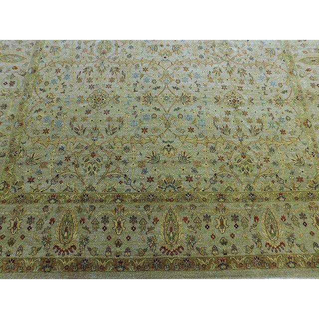 Light olive-green tone with floral decoration. Low cut wool pile on cotton foundation. Herbal washed for vintage look....