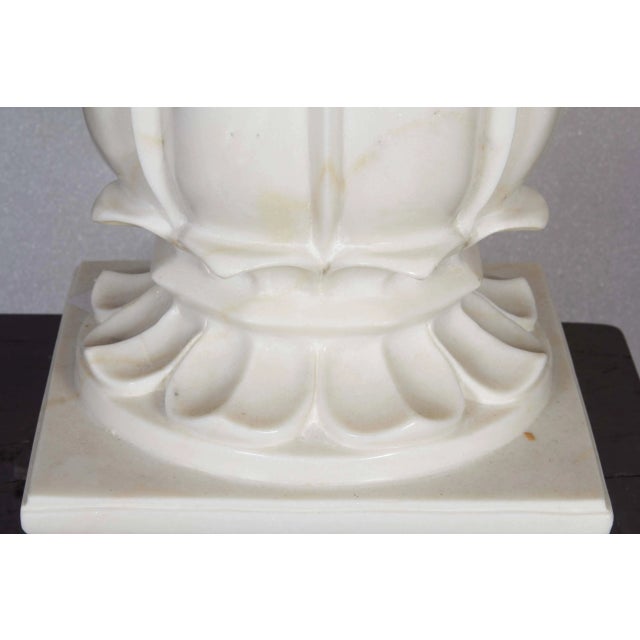 A large white marble carpet weight, hand-crafted in India, 1970s. Carved in a classic orb style on a square base, out of a...