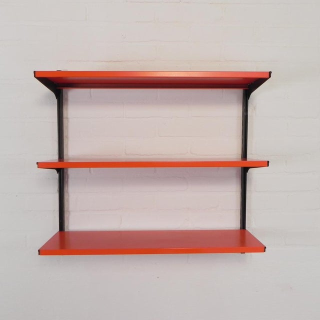 The rack consists of two black metal rails, six shelf supports, and three metal shelves. The rack can be assembled to your...